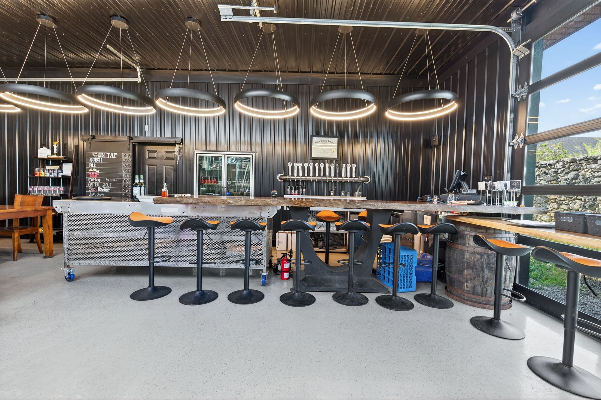 The taproom bar under circular pendant lights
