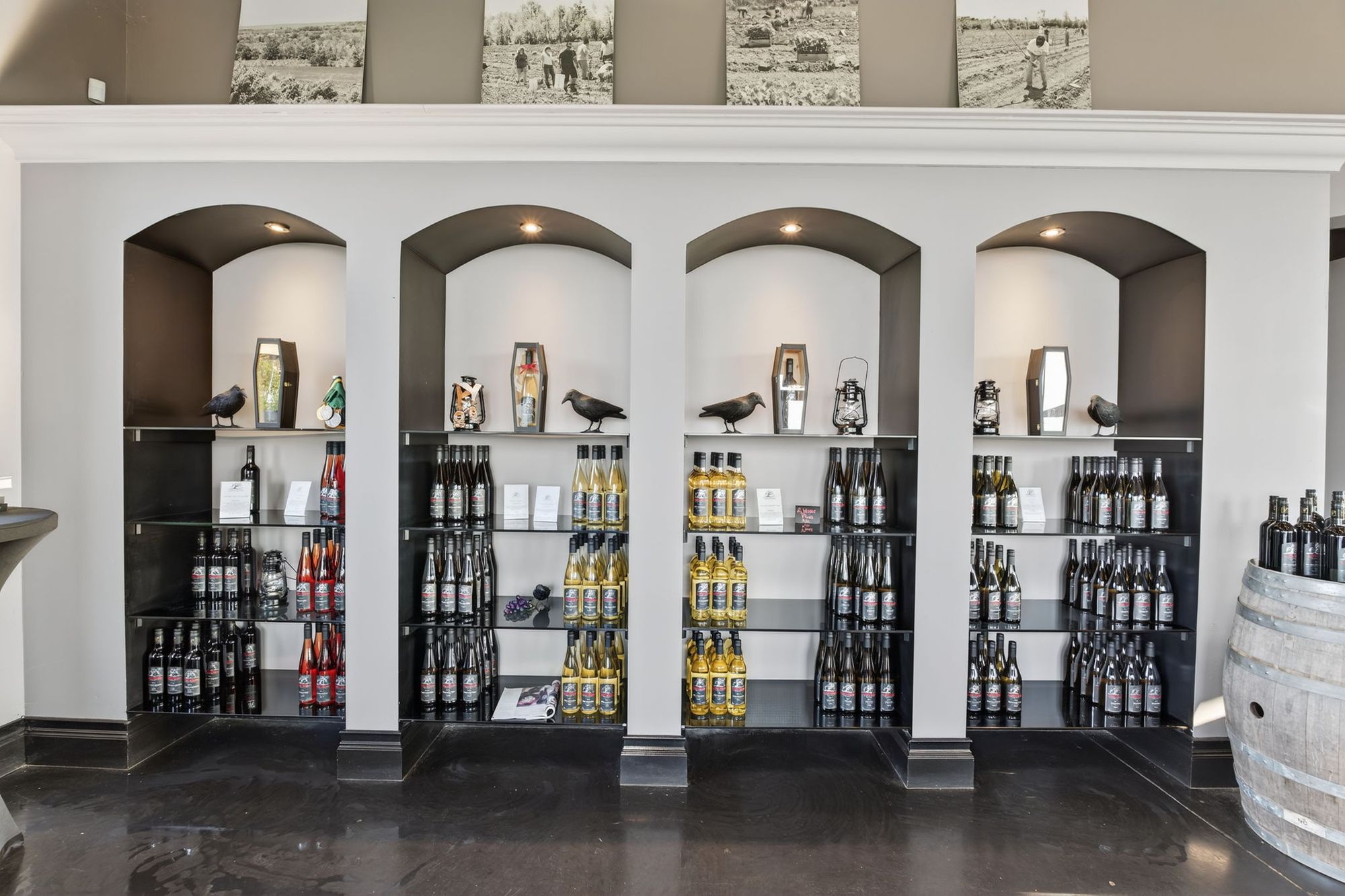 Coffin Ridge bottles displayed in the tasting room's arched shelving